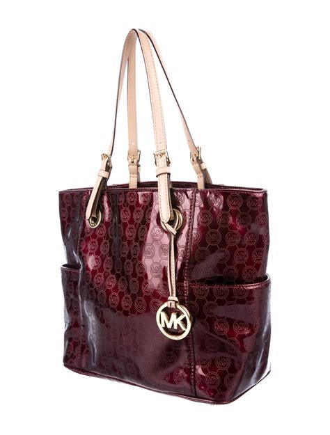 are michael kors handbags all leather|are mk bags real leather.